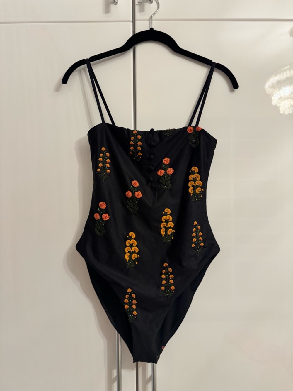 Agua Bendita Black One-Piece Swimsuit with Orange and Yellow Floral Embroidery